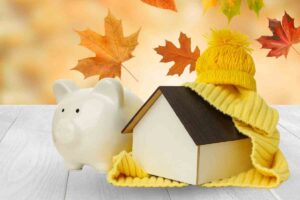 casetta autunnale con salvadanaio